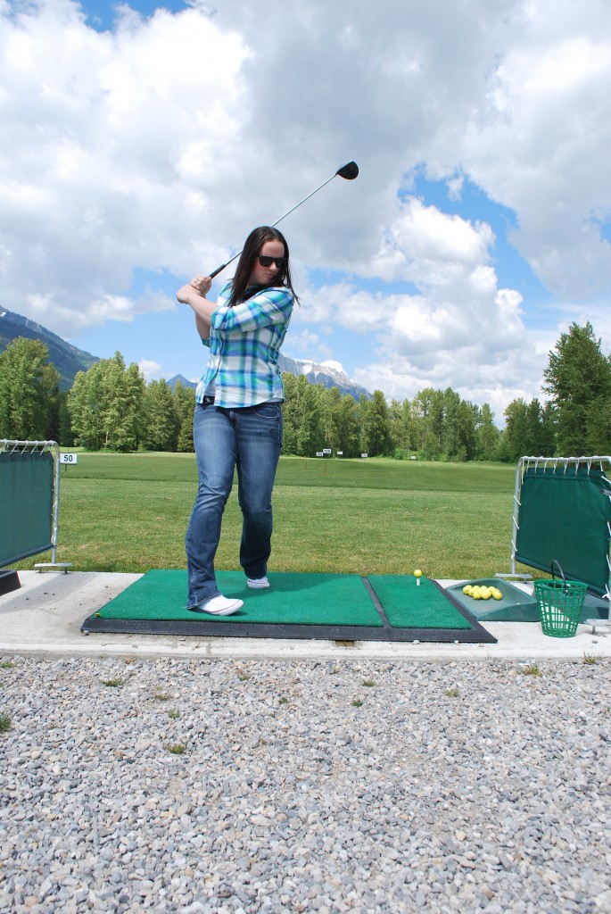 Golfing in Fernie at the driving range