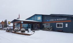 Snow falling on the Red Tree Lodge in Fernie BC